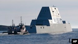 The first Zumwalt-class destroyer, the USS Zumwalt , the largest ever built for the U.S. Navy, leaves the Kennebec River, Dec. 7, 2015,.