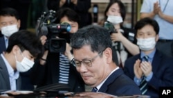 South Korean Unification Minister Kim Yeon-chul gets into a car as he leaves the government complex in Seoul, South Korea, June 19, 2020. 