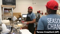 Workers in the B.Good kitchen inside Kitchen United's Chicago, Ill., location prepare food for delivery on Aug. 29, 2019