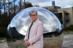 Sharon Peacock, director of COVID-19 Genomics UK, poses for a portrait on the grounds of the Wellcome Sanger Institute's 55-acre campus south of Cambridge, Britain March 12, 2021. (REUTERS/Dylan Martinez)