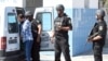 Tunisian security forces man a checkpoint at the entrance of the resort area on the outskirts of Sousse south of the capital Tunis following a shooting attack at the beach resort Friday, June 27, 2015.