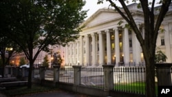 FILE - The U.S. Treasury Building is seen in Washington, Oct. 16, 2013.