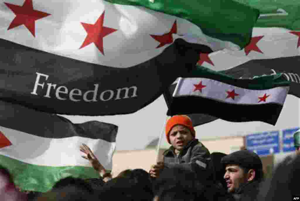 Syrians chant anti-Bashar al-Assad slogans during a protest in front of the Syrian embassy in Amman, Jordan, Friday, Feb. 17, 2012. (AP photo/Mohammad Hannon)