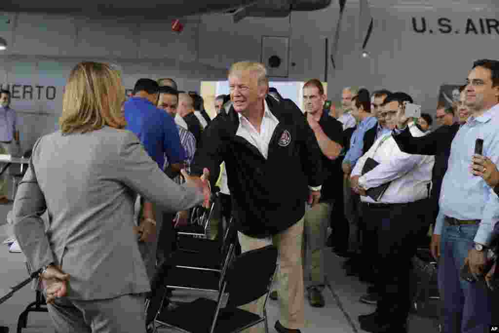 President Donald Trump arrives at Luis Muniz Air National Guard Base to survey hurricane damage and recovery efforts, Oct. 3, 2017, in San Juan, Puerto Rico. 