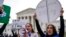 Abortion rights activists rally in front of the U.S. Supreme Court on March 26, 2024, in Washington. 