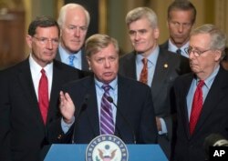Sen. Lindsey Graham, R-S.C., joined by, from left, Sen. John Barrasso, R-Wyo., Majority Whip John Cornyn, R-Texas, Sen. Bill Cassidy, R-La., Sen. John Thune, R-S.D., and Senate Majority Leader Mitch McConnell, R-Ky., speaks to reporters as he pushes a last-ditch effort to uproot former President Barack Obama's health care law, at the Capitol in Washington, Sept. 19, 2017.