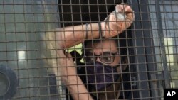 Indian television news anchor Arnab Goswami sits inside a police vehicle after he was produced in a court following his arrest in Mumbai, India, Wednesday, Nov. 4, 2020. 