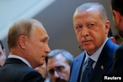 Russian President Vladimir Putin, left, meets with his Turkish counterpart Recep Tayyip Erdogan in Sochi, Russia, Sept. 17, 2018.