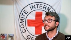 FILE - Pawel Krzysiek, the ICRC communication coordinator, speaks during an interview with The Associated Press in Damascus , Syria, Dec. 1, 2016.