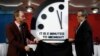 Robert Rosner, chairman of the Bulletin of the Atomic Scientists, right, and Bulletin of the Atomic Scientists member Lawrence Krauss, left, unveil the Doomsday Clock during a news conference at the National Press Club in Washington, Jan. 25, 2018. 
