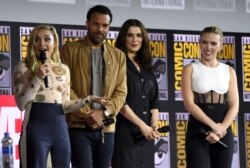 FILE - From left, Florence Pugh, O.T. Fagbenle, Rachel Weisz and Scarlett Johansson participate during the "Black Widow" portion of the Marvel Studios panel on day three of Comic-Con International, July 20, 2019, in San Diego.