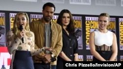 FILE - From left, Florence Pugh, O.T. Fagbenle, Rachel Weisz and Scarlett Johansson participate during the "Black Widow" portion of the Marvel Studios panel on day three of Comic-Con International, July 20, 2019, in San Diego.