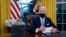 President Joe Biden pauses as he signs his first executive orders in the Oval Office of the White House on Wednesday, Jan. 20, 2021, in Washington. (AP Photo/Evan Vucci) Joe Biden