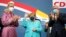 German Chancellor Angela Merkel waves as leading CDU members applaud after the parliament elections at the Christian Democratic Union, CDU, party's headquarters in Berlin, Sept. 26, 2021