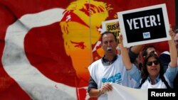 Members of the Journalists Union of Turkey (TGS) carry placards reading 'Enough!' during a demonstration to mark World Press Freedom Day in central Istanbul, Turkey, May 3, 2017.