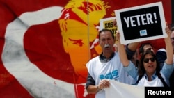 Members of the Journalists Union of Turkey (TGS) carry placards reading 'Enough!' during a demonstration to mark World Press Freedom Day in central Istanbul, Turkey, May 3, 2017.