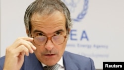 FILE - Rafael Grossi, Director General of the International Atomic Energy Agency waits for the start of the Board of Governors meeting in Vienna, Austria, Sept. 9, 2024.