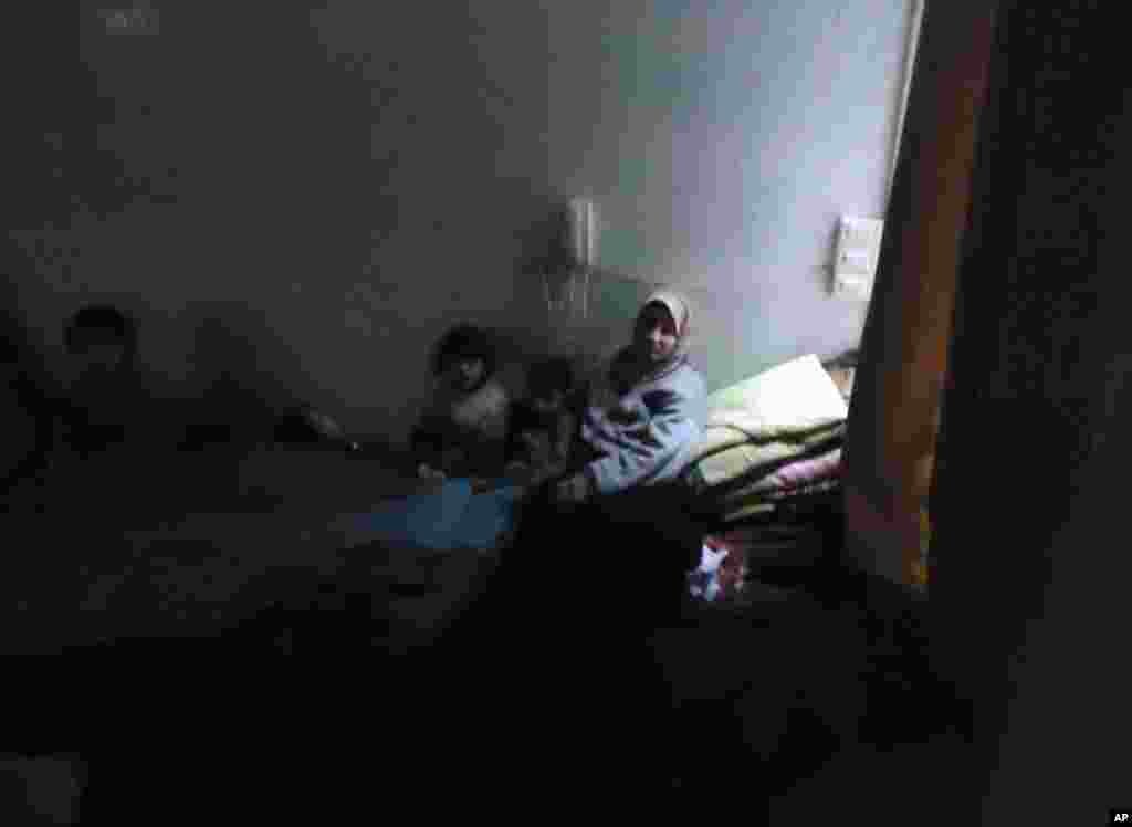 Residents rest in a shelter in Bab Amro, a Sunni district in Homs, February 8, 2012. (Reuters)