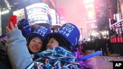 Un selfie en Times Square, Nueva York, poco después de la medianoche.