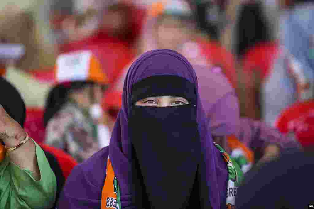 A Muslim supporter of India&#39;s opposition Congress party looks on during an election rally on the outskirts of Srinagar, Indian controlled Kashmir.