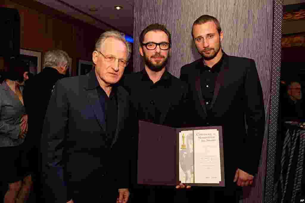 Michael Roskam, "Bullhead" (center), accepts his certificate of nomination from Oscar nominee Michael Mann (left) with actor Matthias Schoenaerts for the 84th Academy Awards from at a Foreign Language Film Award reception held in the Grand Lobby of the Sa