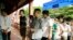 Cambodians wait in line at a polling station in Phnom Penh’s Sen Sok district, Cambodia, July 29, 2018. (Ty Aulissa/VOA Khmer) 