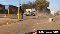 FILE - The international community and human rights groups have condemned the way President Emmerson Mnangagwa's government used the army to disperse opposition protesters demanding the release of credible election results. At least six people were killed in the protests in Harare, Aug. 1, 2018.