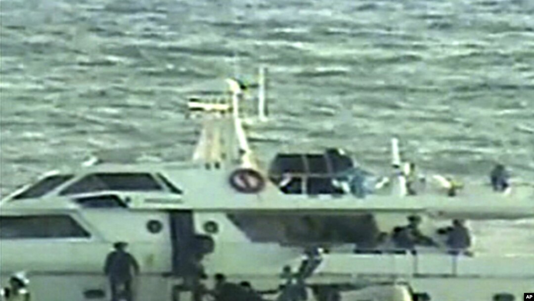In this video image released by the Israeli Defense Ministry on November 4, 2011, Israeli soldiers on several small military boats appear to board a civilian boat believed to be one of two protest boats trying to violate Israel's blockade of the Gaza Stri