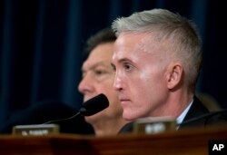 House Benghazi Committee Chairman Rep. Trey Gowdy, R-S.C. listens as Democratic presidential candidate, former Secretary of State Hillary Clinton testifies before the committee on Capitol Hill, in Washington, Oct. 22, 2015.