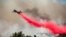 The Global Supertanker drops retardant while battling the Glass Fire in Napa County, Calif., on Sunday, Sept. 27, 2020.