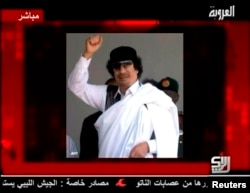 A still image of Libyan leader Muammar Gaddafi is displayed to accompany his audio message broadcast by Syrian TV channel Al-Orouba, Aug. 25, 2011. The former Libyan leader was killed in October, 2011.
