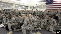 U.S. Army soldiers from 1st Brigade, 3rd Infantry Division, gather for a briefing after arriving at Hunter Army Airfield in Savannah, Ga. after an 18-hour journey home from a yearlong deployment in Iraq, (File Photo - 04 Dec 2010)
