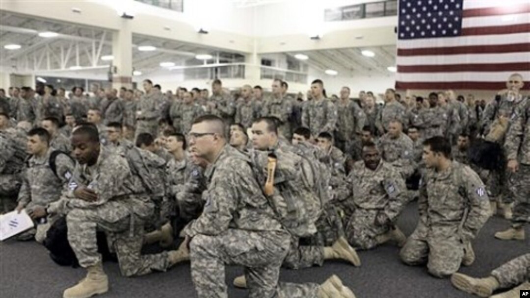 U.S. Army soldiers from 1st Brigade, 3rd Infantry Division, gather for a briefing after arriving at Hunter Army Airfield in Savannah, Ga. after an 18-hour journey home from a yearlong deployment in Iraq, (File Photo - 04 Dec 2010)