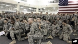 U.S. Army soldiers from 1st Brigade, 3rd Infantry Division, gather for a briefing after arriving at Hunter Army Airfield in Savannah, Ga. after an 18-hour journey home from a yearlong deployment in Iraq, (File Photo - 04 Dec 2010)