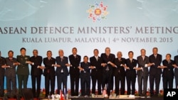 ASEAN leaders join hands as they pose for photographers after the Association of Southeast Asian Nations (ASEAN) Defense Ministers' Meeting Plus in Kuala Lumpur, Malaysia, Nov. 4, 2015.