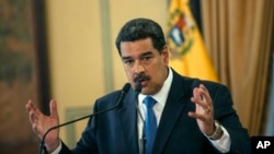 Venezuela's President Nicolas Maduro speaks during a press conference at Miraflore's Presidential Palace in Caracas, Venezuela, Feb. 8, 2019. 