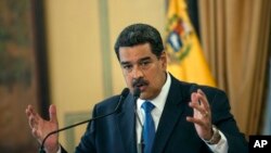 FILE - Venezuela's President Nicolas Maduro speaks during a press conference at Miraflore's Presidential Palace in Caracas, Venezuela, Feb. 8, 2019. 