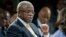FILE - Uganda's then-Prime Minister Amama Mbabazi gives a speech at the World Economic Forum Meeting on Africa, Cape Town, S. Africa, May 9, 2013. 