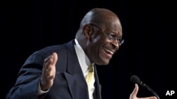 Republican presidential hopeful Herman Cain gestures during a speech at the Values Voter Summit in Washington, October 7, 2011.