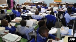 File - Pupils of Winnie Ngwekasi Primary School in Soweto study in a classroom in Johannesburg, South Africa, November 2009.