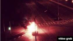 An unconfirmed video grab image of a vehicle burning in a street in Grozny, Chechnya.