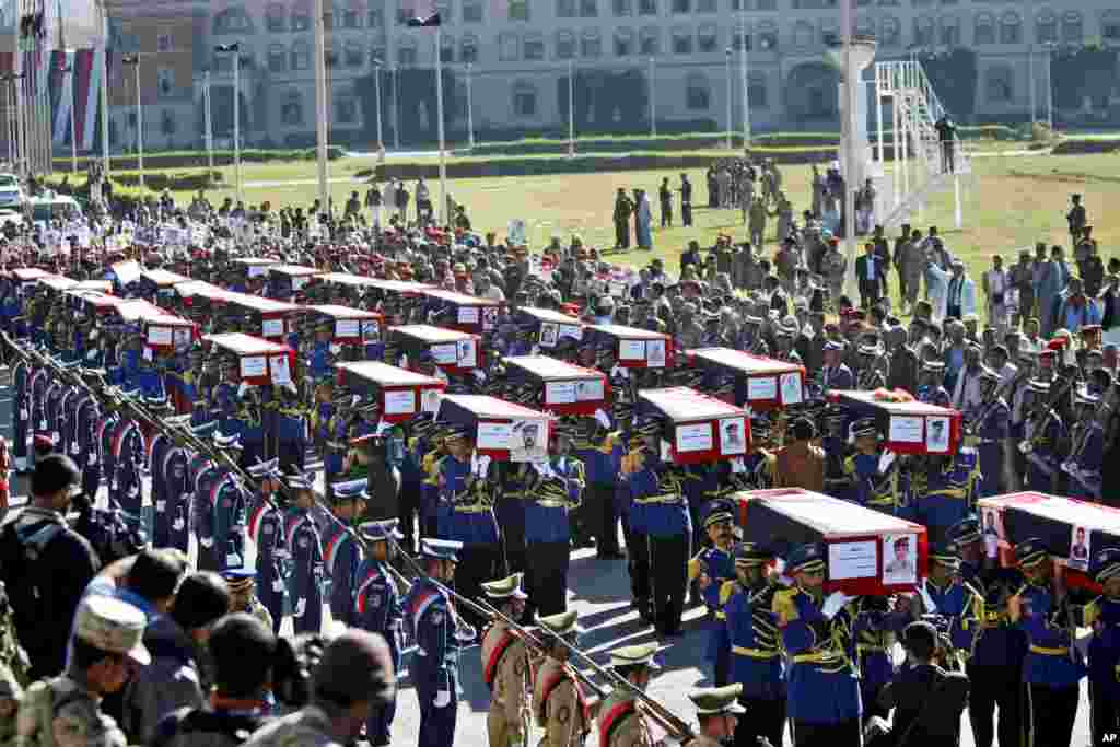 Yemeni honor guards carry the coffins of victims killed in a suicide car bombing and an attack by heavily armed gunmen, during their funeral at the Defense Ministry complex in Sana&#39;a. Among the dead at the Defense Ministry complex, which also houses a military hospital, were soldiers and civilians, including seven foreigners &mdash; two Germans, two Vietnamese, two Filipinos and one Indian, according to the Supreme Security Commission.