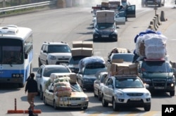 South Korean vehicles loaded with goods arrive from North Korea's Kaesong industrial complex at the customs, immigration and quarantine office near the border village of Panmunjom in Paju, South Korea, April 27, 2013.