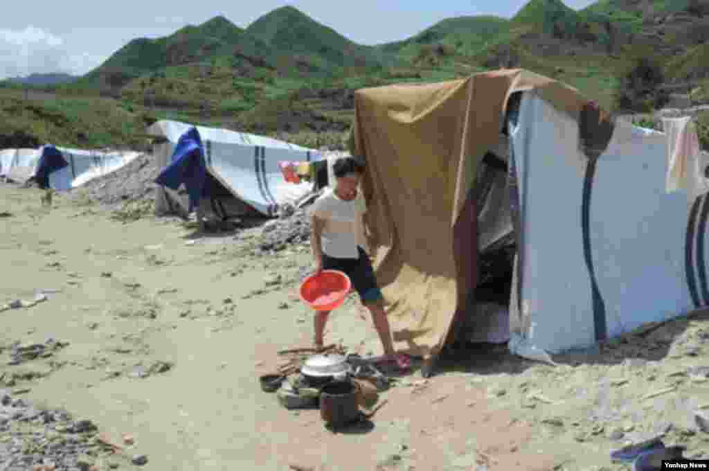 최근 폭우로 폐허가 된 북한 평안남도 성천군 한 마을. 13일 교도통신이 보도했다.