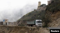 FILE - A truck drives on the main highway to the port city of Massawa from Eritrea's capital Asmara.