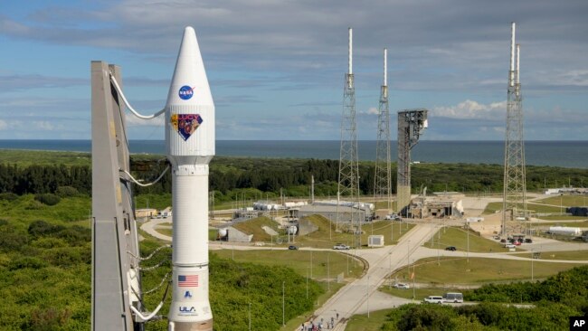 In this image released by NASA, a United Launch Alliance Atlas V rocket with the Lucy spacecraft aboard is rolled out of the Vertical Integration Facility to the launch pad at Space Launch Complex 41, Thursday, Oct. 14, 2021, in Cape Canaveral, Fla. (Bill Ingalls/NASA)