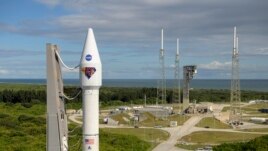 In this image released by NASA, a United Launch Alliance Atlas V rocket with the Lucy spacecraft aboard is rolled out of the Vertical Integration Facility to the launch pad at Space Launch Complex 41, Thursday, Oct. 14, 2021, in Cape Canaveral, Fla. (Bill Ingalls/NASA)