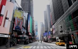 An almost empty street is seen at Times Square in New York City. The city was under a lockdown order on March 16, 2020.