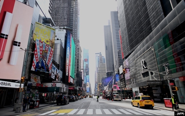 An almost empty street is seen at Times Square in New York City. The city was under a lockdown order on March 16, 2020.