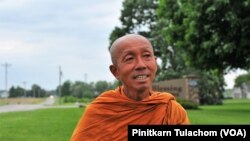 Buddhist monk Sutham Nateetong talks with VOA Thai after finished his daily walk outside Arcola, IN. June 8, 2019.